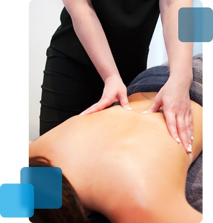 Massist massaging woman back