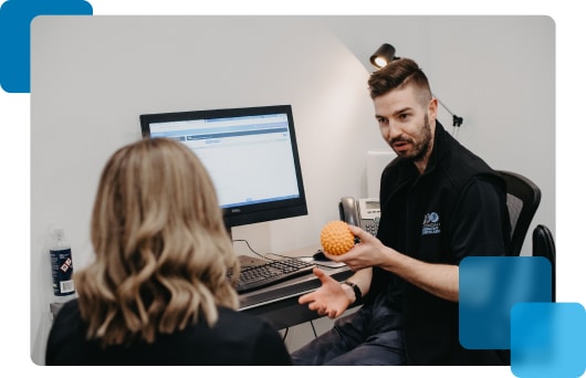 Osteopath Educating Client